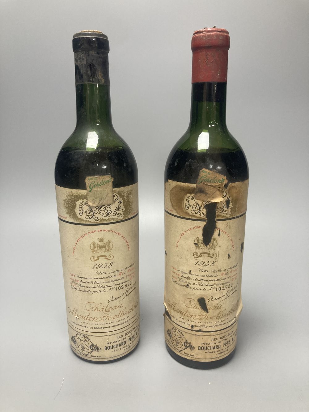 Two bottles of Chateau Mouton Rothschild 1958 (one foil lacking)
